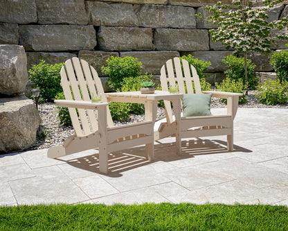 POLYWOOD Classic 3-Piece Folding Adirondack Set With Connecting Table in Sand in an outdoor setting