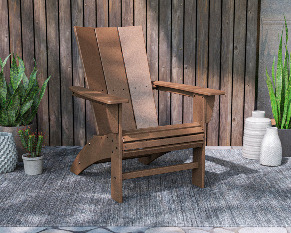POLYWOOD Modern Curveback Adirondack Chair in Teak in an outdoor setting