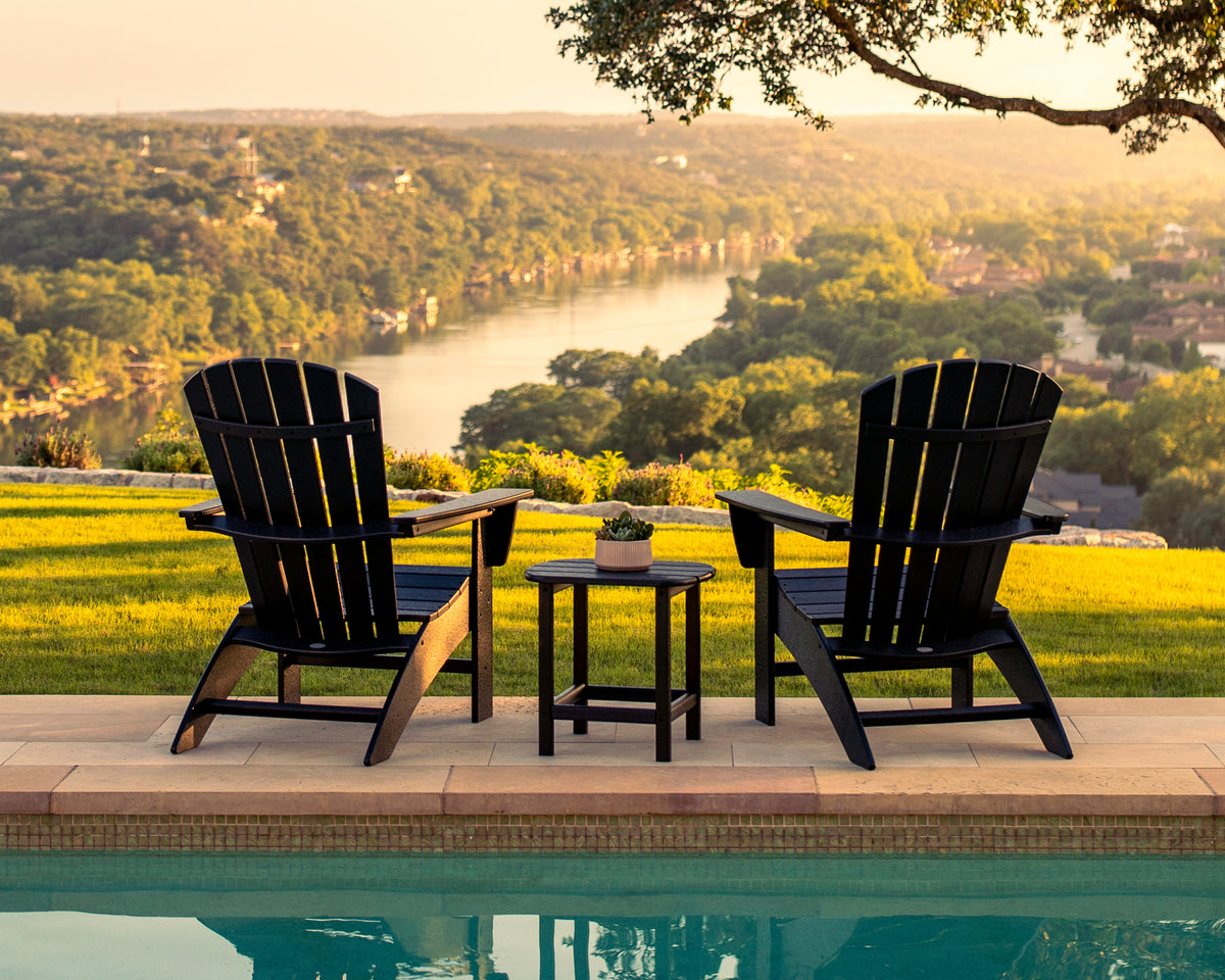 Lifestyle photo of the POLYWOOD Nautical 3-Piece Curveback Adirondack Set in Black