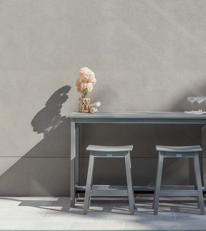 Berlin Gardens Balcony collection: gray balcony table and stools against a wall