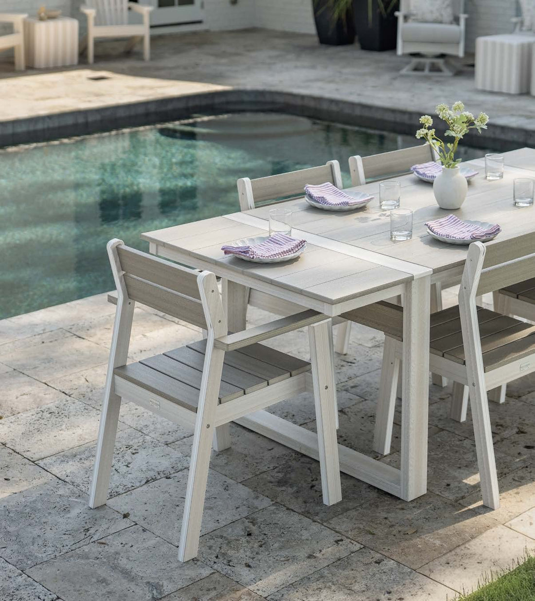 Berlin Gardens Calla collection: white dining table and chairs by a pool