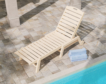 Lifestyle photo of the POLYWOOD Nautical Chaise with Wheels in Sand