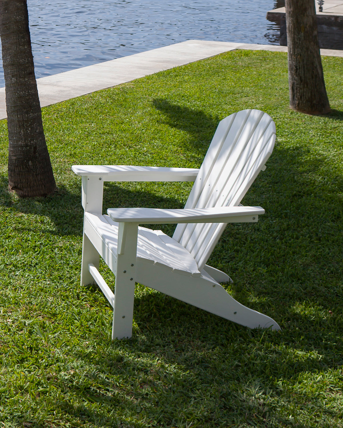 Lifestyle photo of the POLYWOOD South Beach Adirondack in White