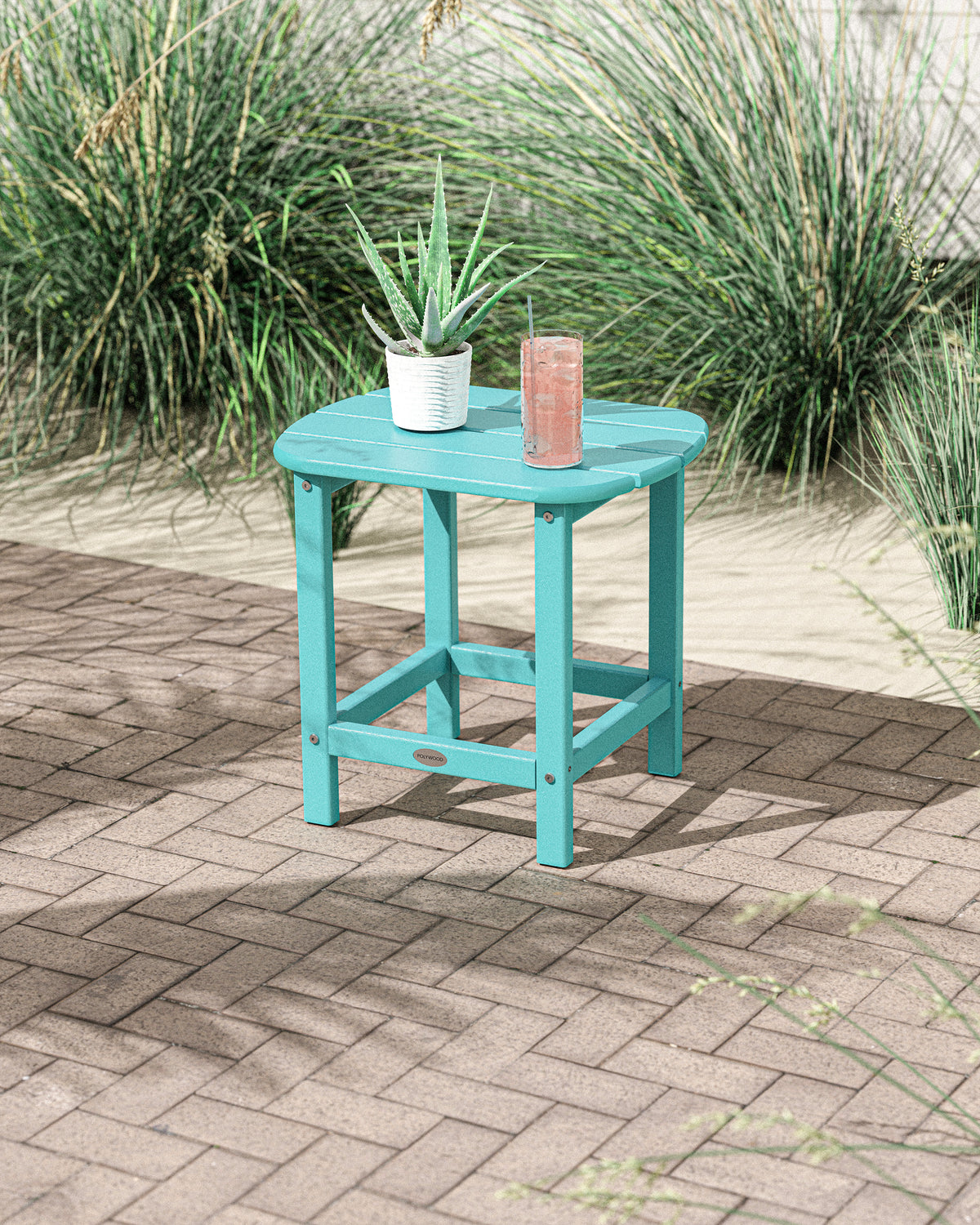 Lifestyle photo of the POLYWOOD South Beach 18" Side Table in Aruba