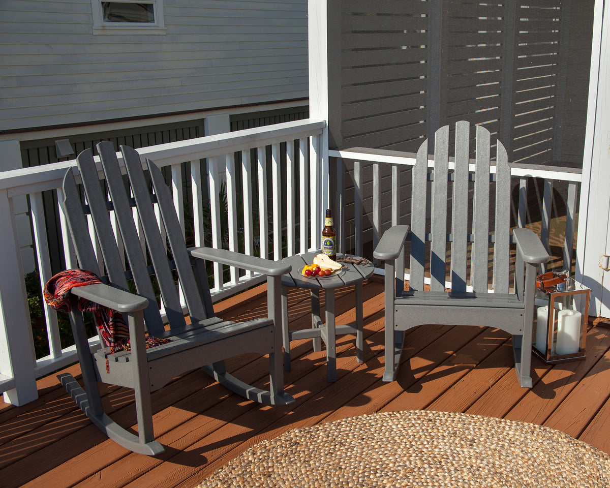 Lifestyle photo of the POLYWOOD Classic Adirondack Rocking Chair in Slate Grey