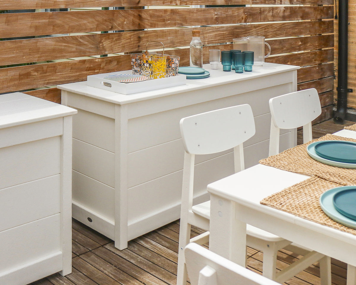 Lifestyle photo of the POLYWOOD 68" Storage Box Table in White (2)