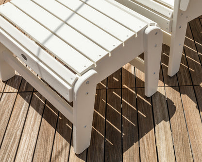 POLYWOOD Grand Upright Adirondack Ottoman in White in an outdoor setting
