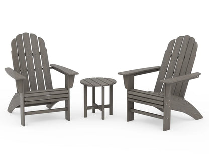 Two gray Adirondack chairs with a matching side table on a white background