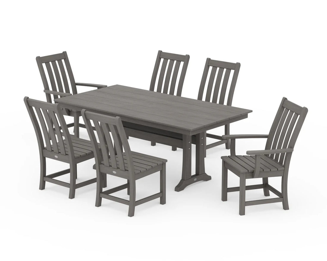 Gray outdoor dining table with six matching chairs on a white background