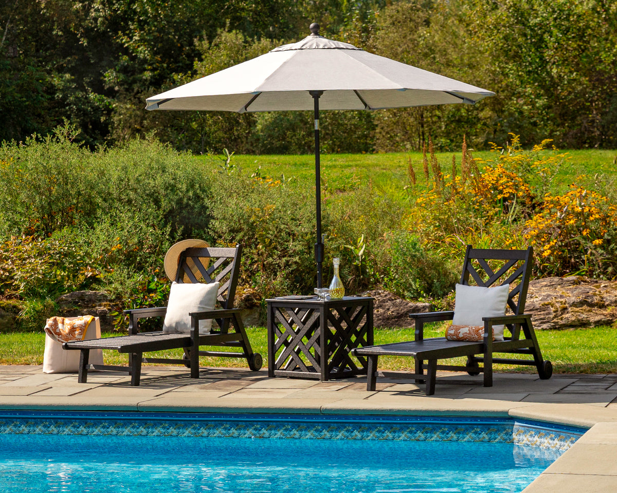 POLYWOOD Chippendale 3-Piece Chaise Set with Umbrella Stand Accent Table in an outdoor setting