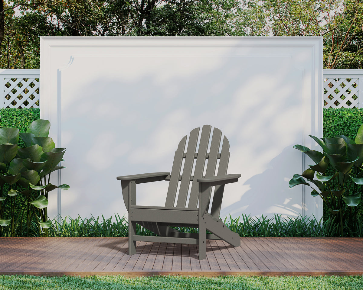 Lifestyle photo of the POLYWOOD Classic Adirondack Chair in Slate Grey (2)