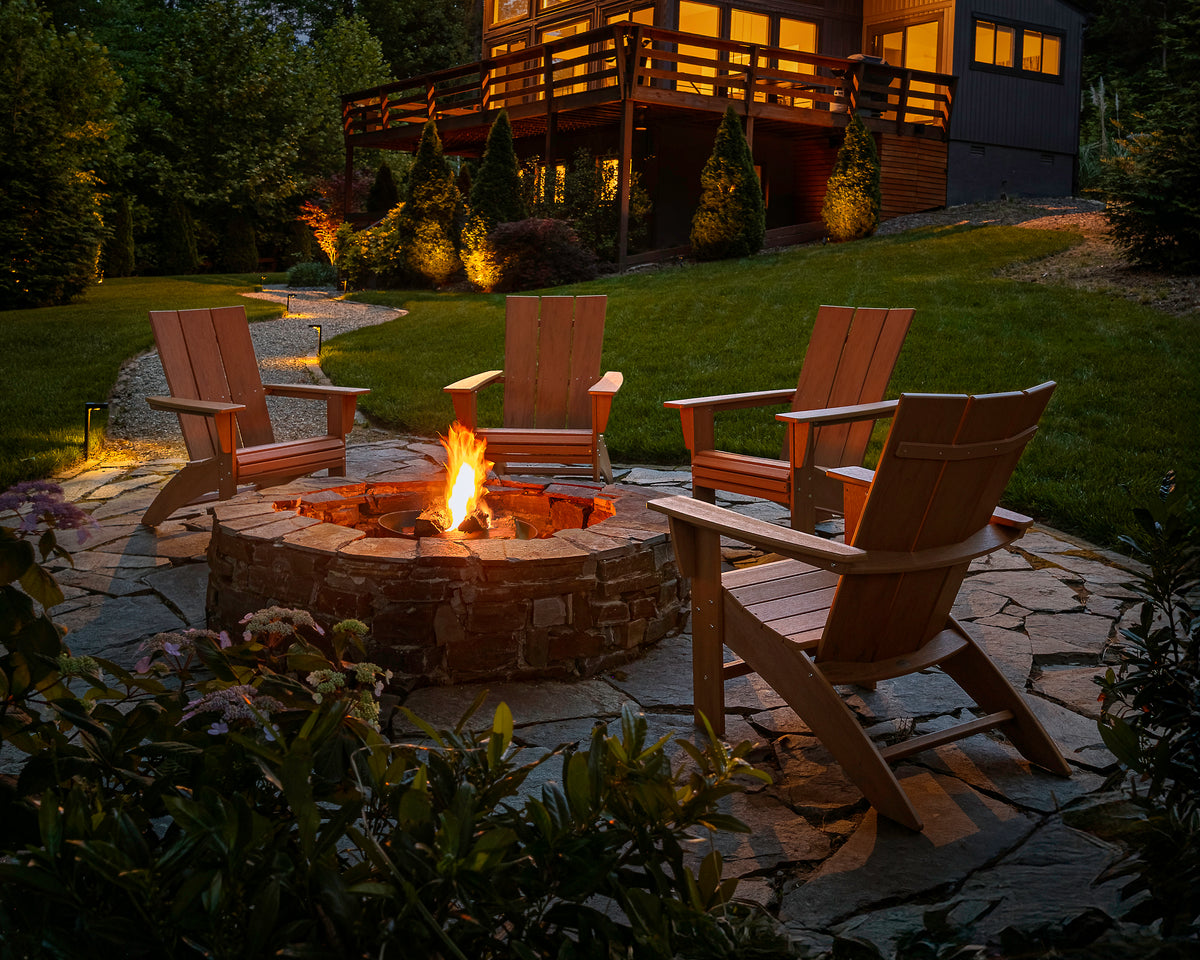 POLYWOOD Modern Curveback Adirondack Chair in Natural in an outdoor setting