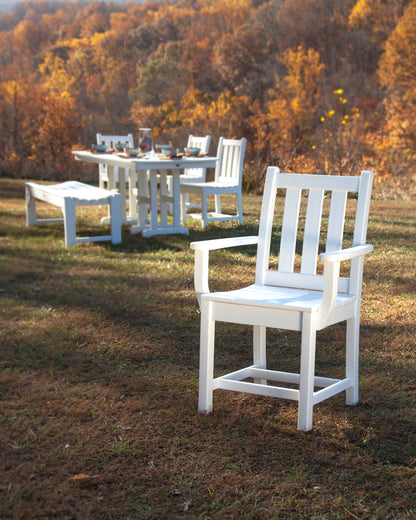POLYWOOD Traditional Garden Dining Arm Chair in White in an outdoor setting