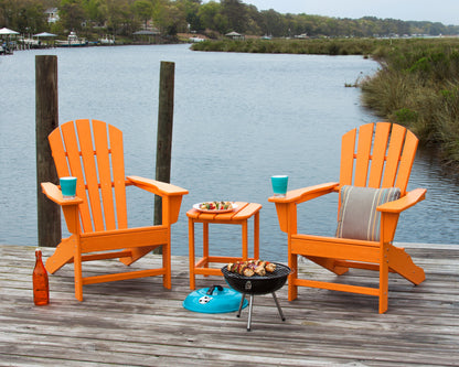 POLYWOOD Palm Coast Adirondack Chair in Tangerine in an outdoor setting