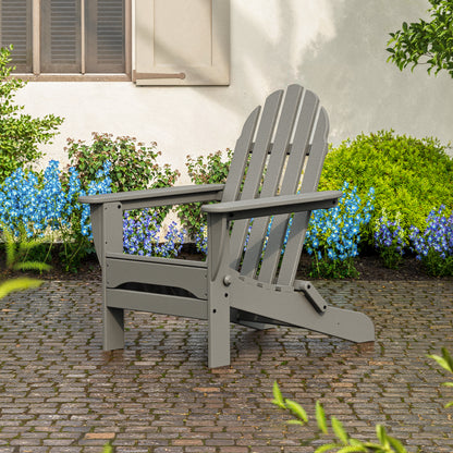 POLYWOOD Classic Folding Adirondack Chair in Slate Grey styled outdoors