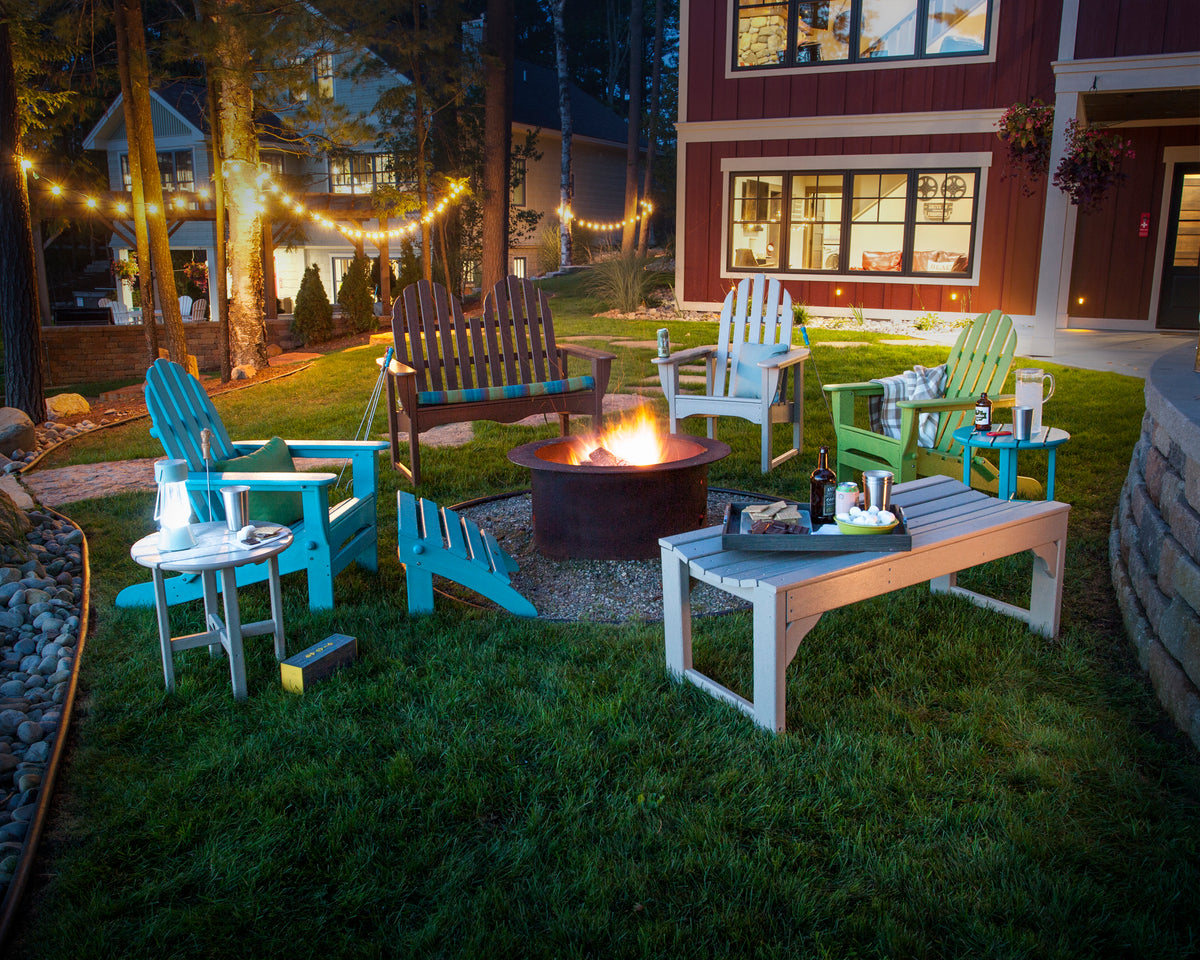 POLYWOOD Classic Folding Adirondack Chair in Aruba in an outdoor setting