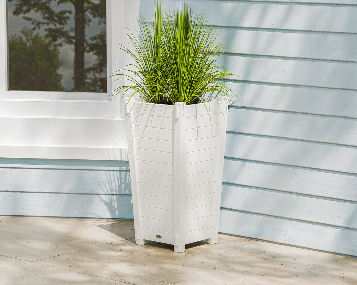 POLYWOOD Nautical Tapered Square Planter Box in White in an outdoor setting