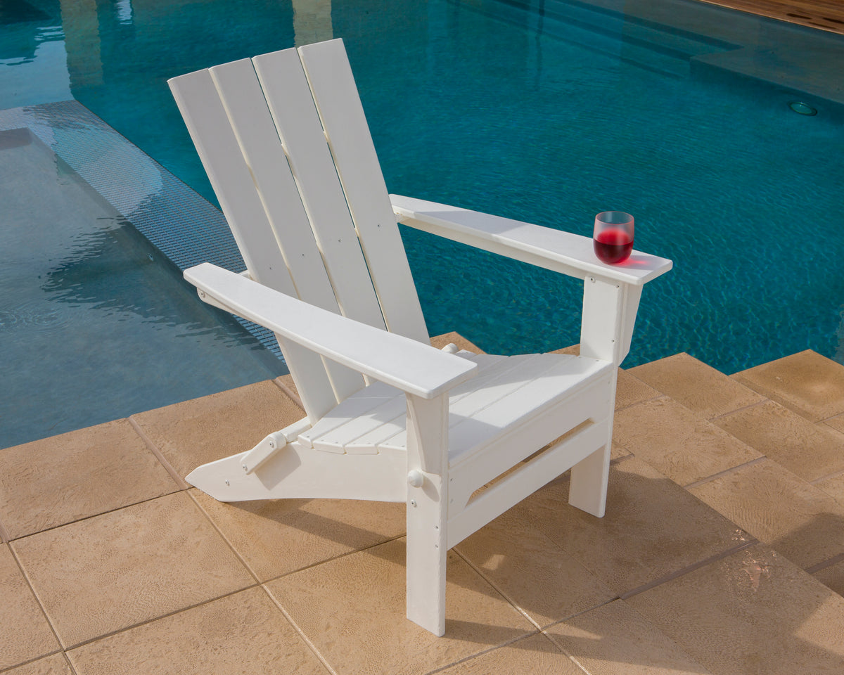Lifestyle photo of the POLYWOOD Quattro Folding Adirondack in White