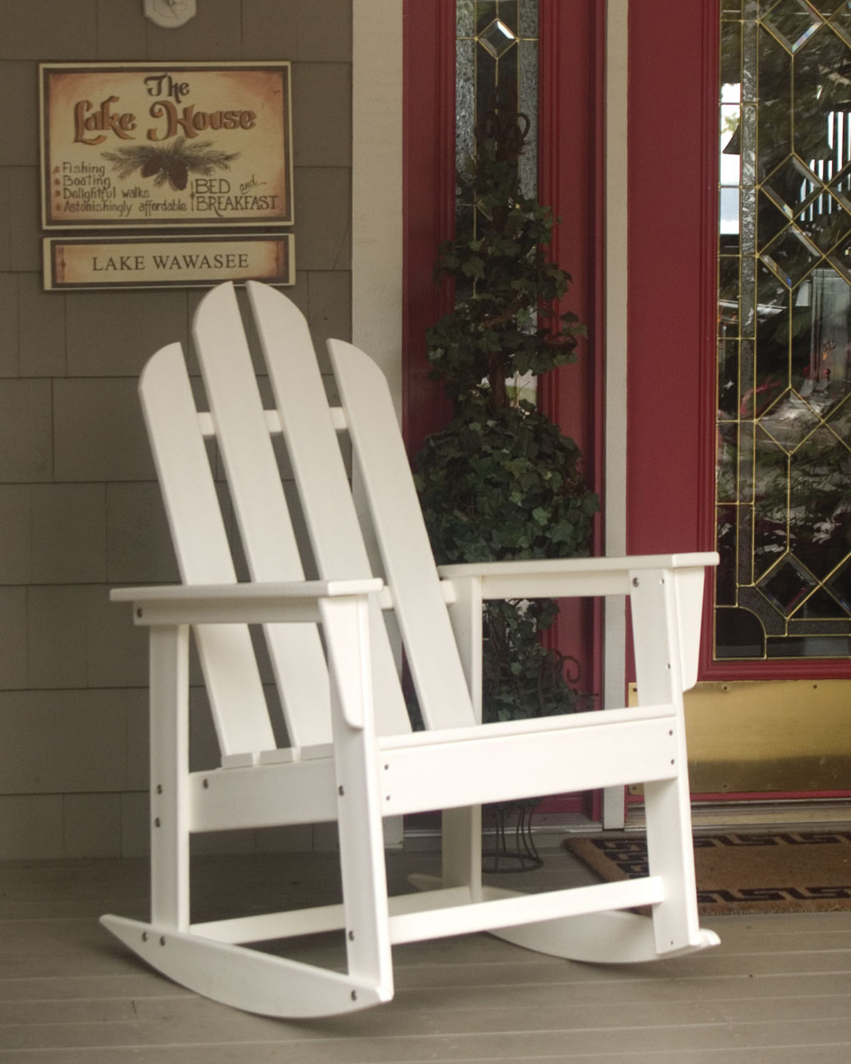 POLYWOOD Long Island Rocking Chair in White in an outdoor setting