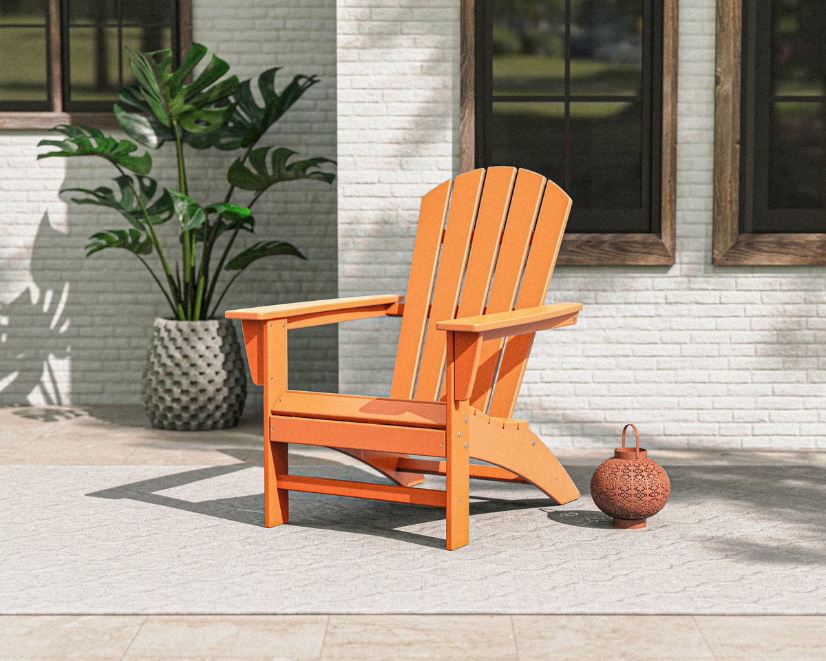 POLYWOOD Nautical Adirondack Chair in Tangerine in an outdoor setting