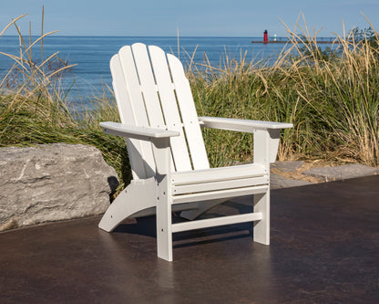 Lifestyle photo of the POLYWOOD Vineyard Curveback Adirondack Chair in White