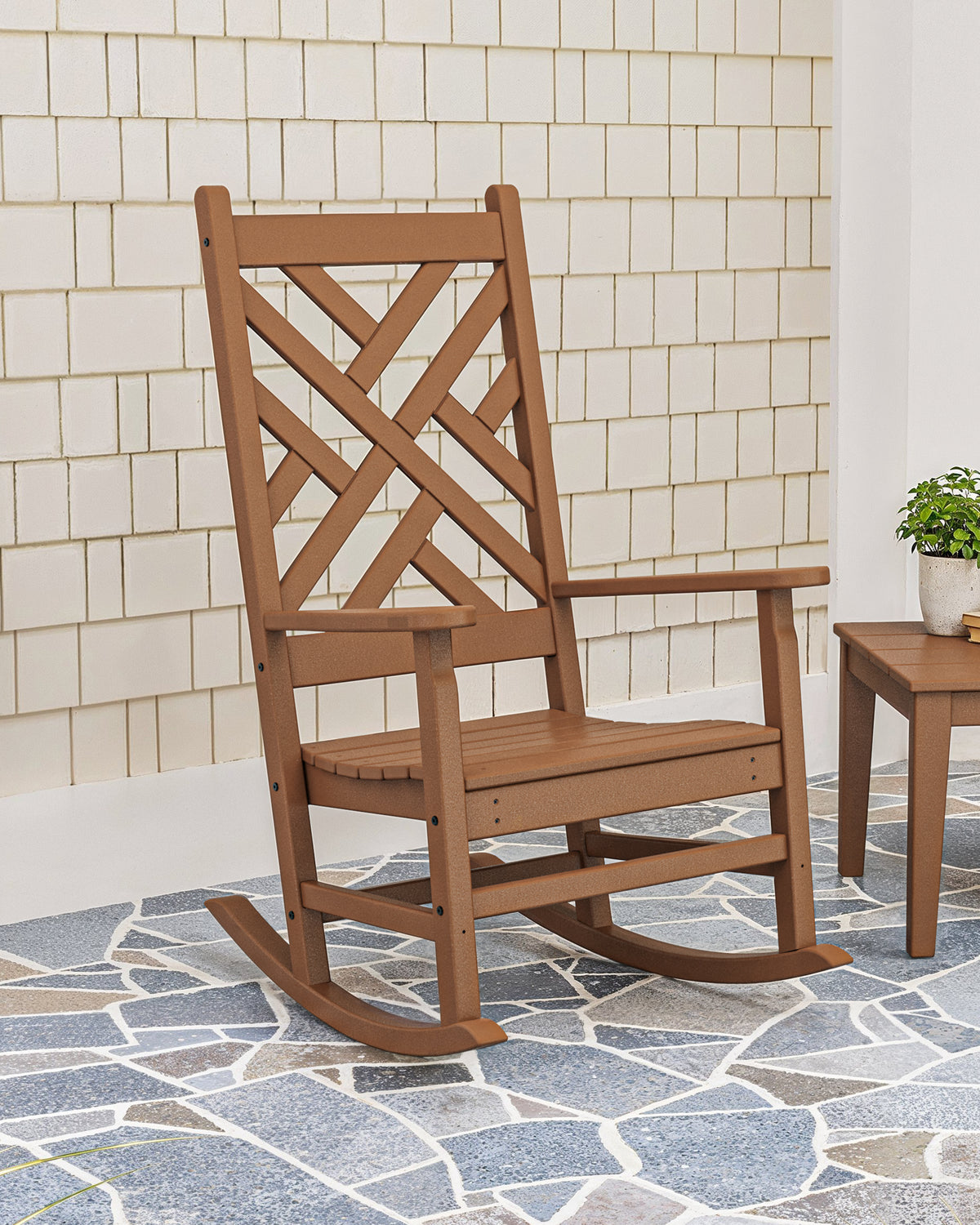 POLYWOOD Chippendale Porch Rocking Chair in Teak in an outdoor setting