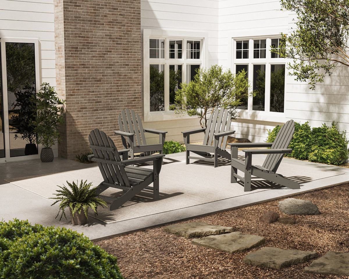 POLYWOOD 4-Piece Classic Adirondack Conversation Set in Slate Grey in an outdoor setting