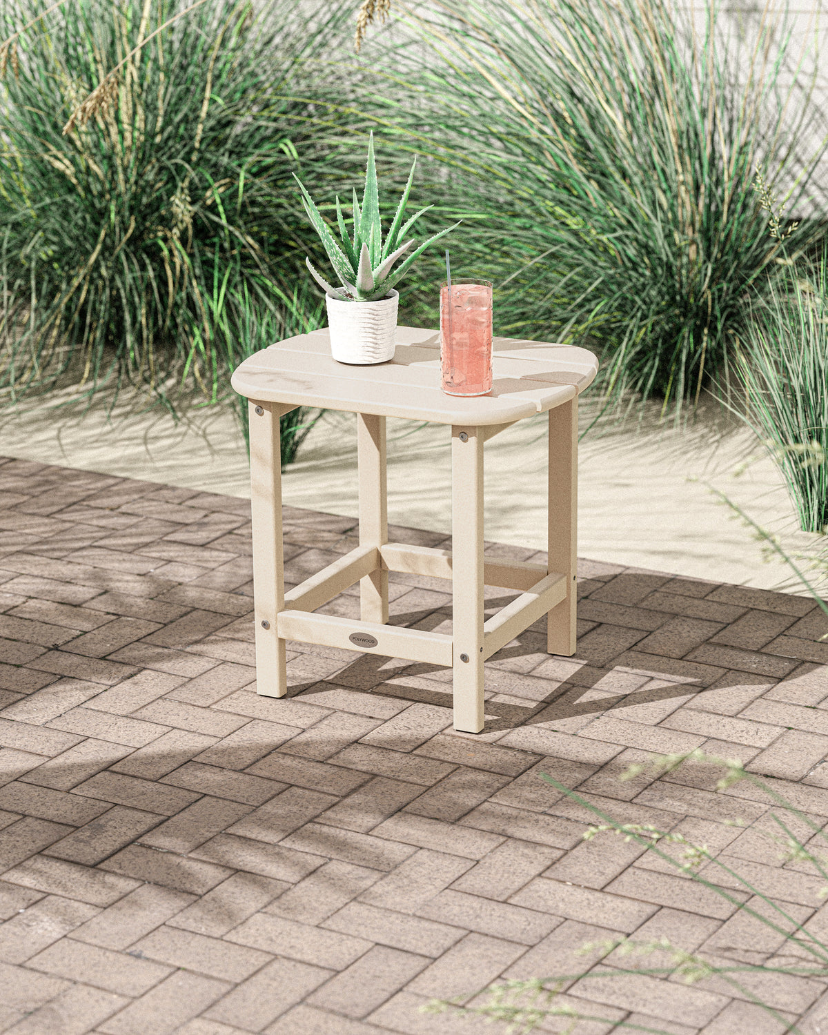 POLYWOOD South Beach 18" Side Table in Sand in an outdoor setting