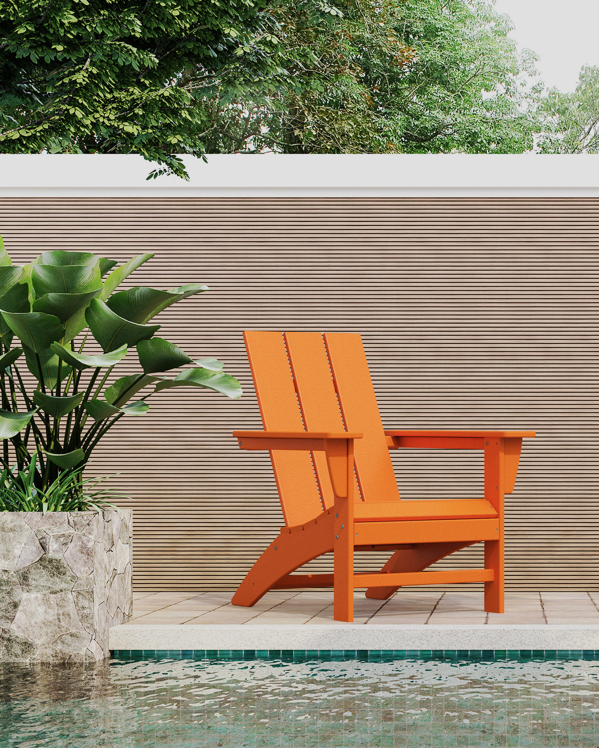 POLYWOOD Modern Adirondack Chair in Tangerine styled outdoors