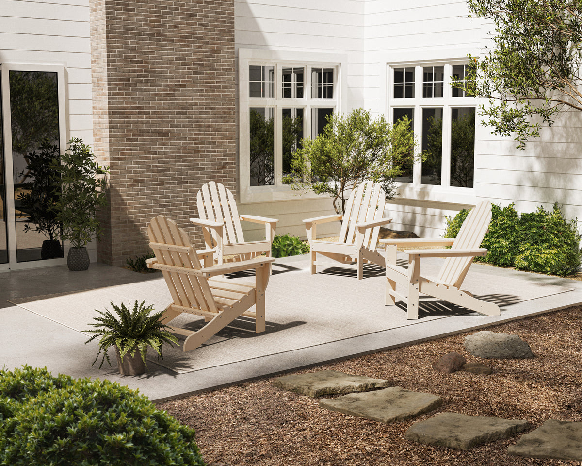 Lifestyle photo of the POLYWOOD 4-Piece Classic Adirondack Conversation Set in Sand