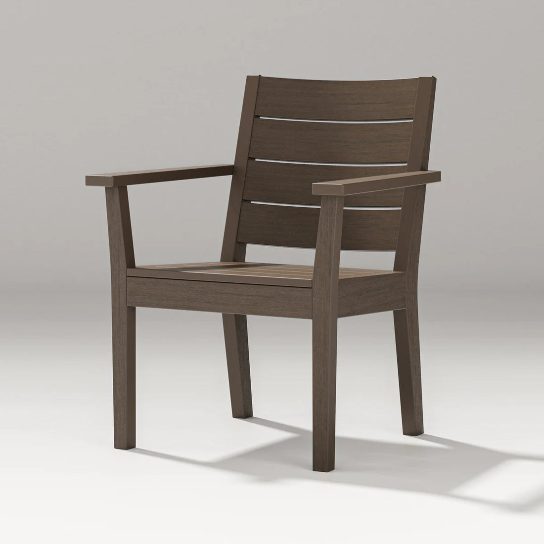 Wooden chair with armrests on a light gray background