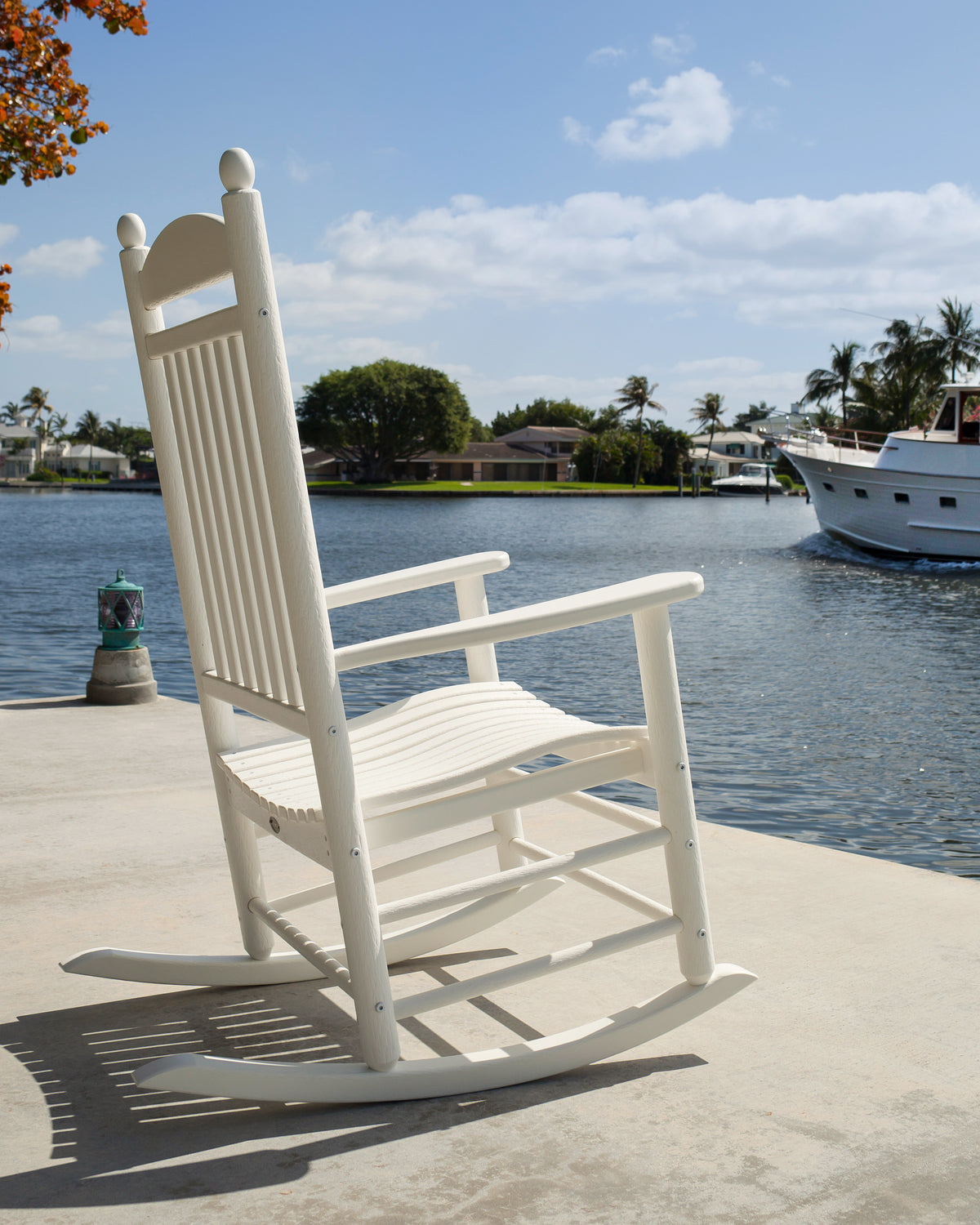 Lifestyle photo of the POLYWOOD Jefferson Rocking Chair in White
