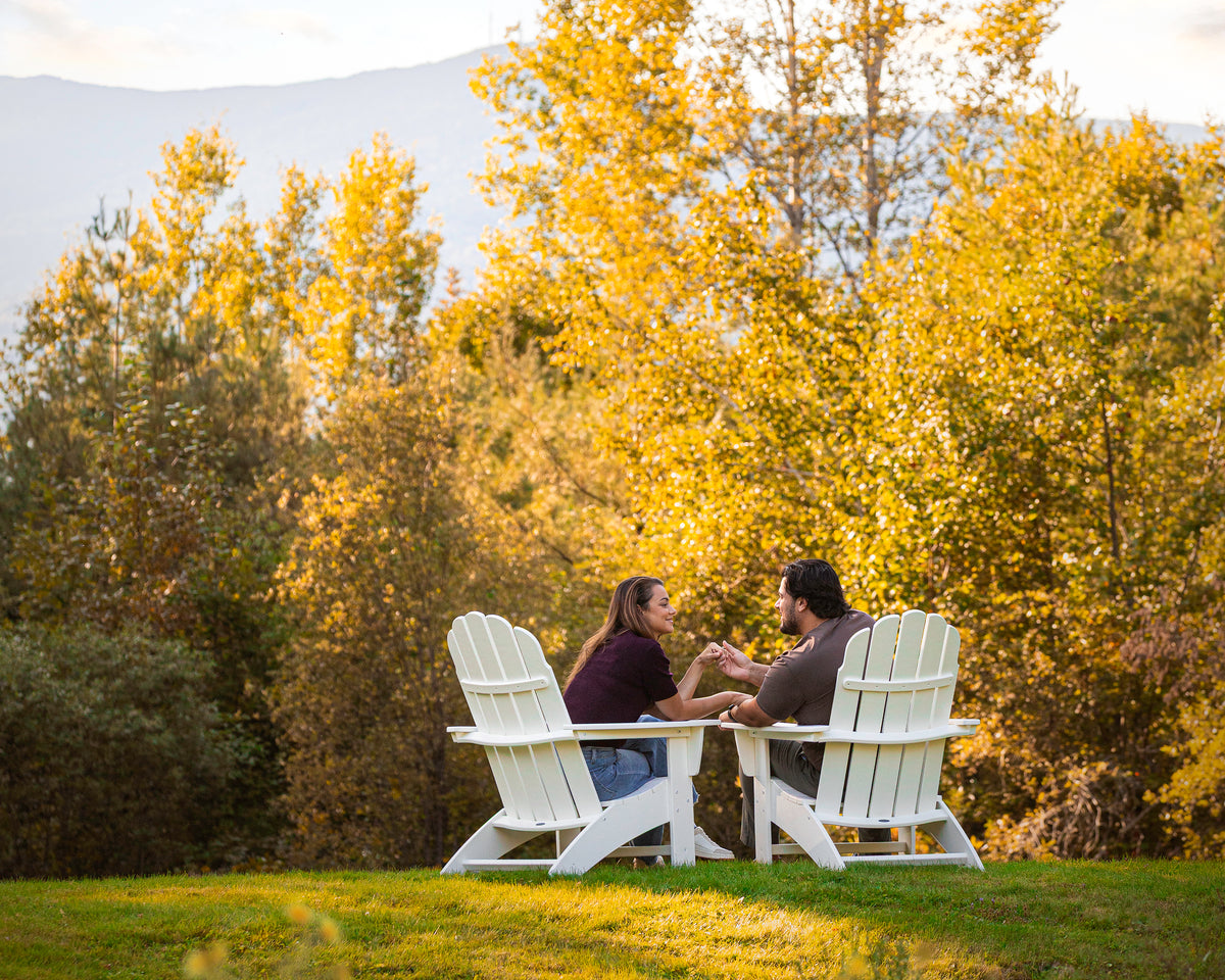 POLYWOOD Vineyard Curveback Adirondack Chair in White in an outdoor setting (3)