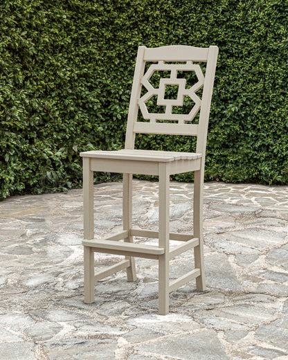 POLYWOOD Chinoiserie Bar Side Chair in Sand in an outdoor setting