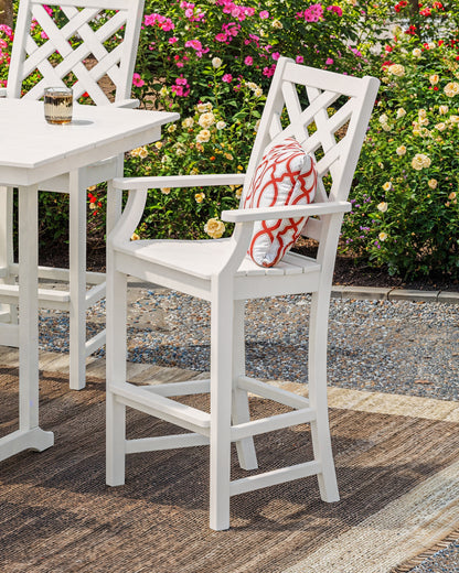 POLYWOOD Wovendale Bar Arm Chair in White in an outdoor setting