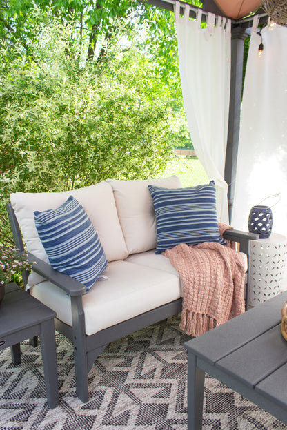 POLYWOOD Vineyard 4-Piece Deep Seating Set with Two Chairs and Loveseat in an outdoor setting