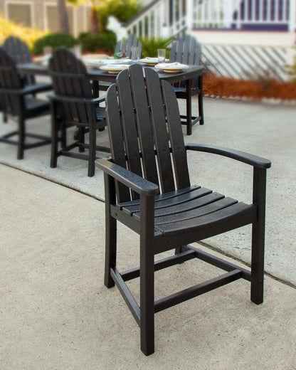 Lifestyle photo of the POLYWOOD Classic Adirondack Dining Chair in Black