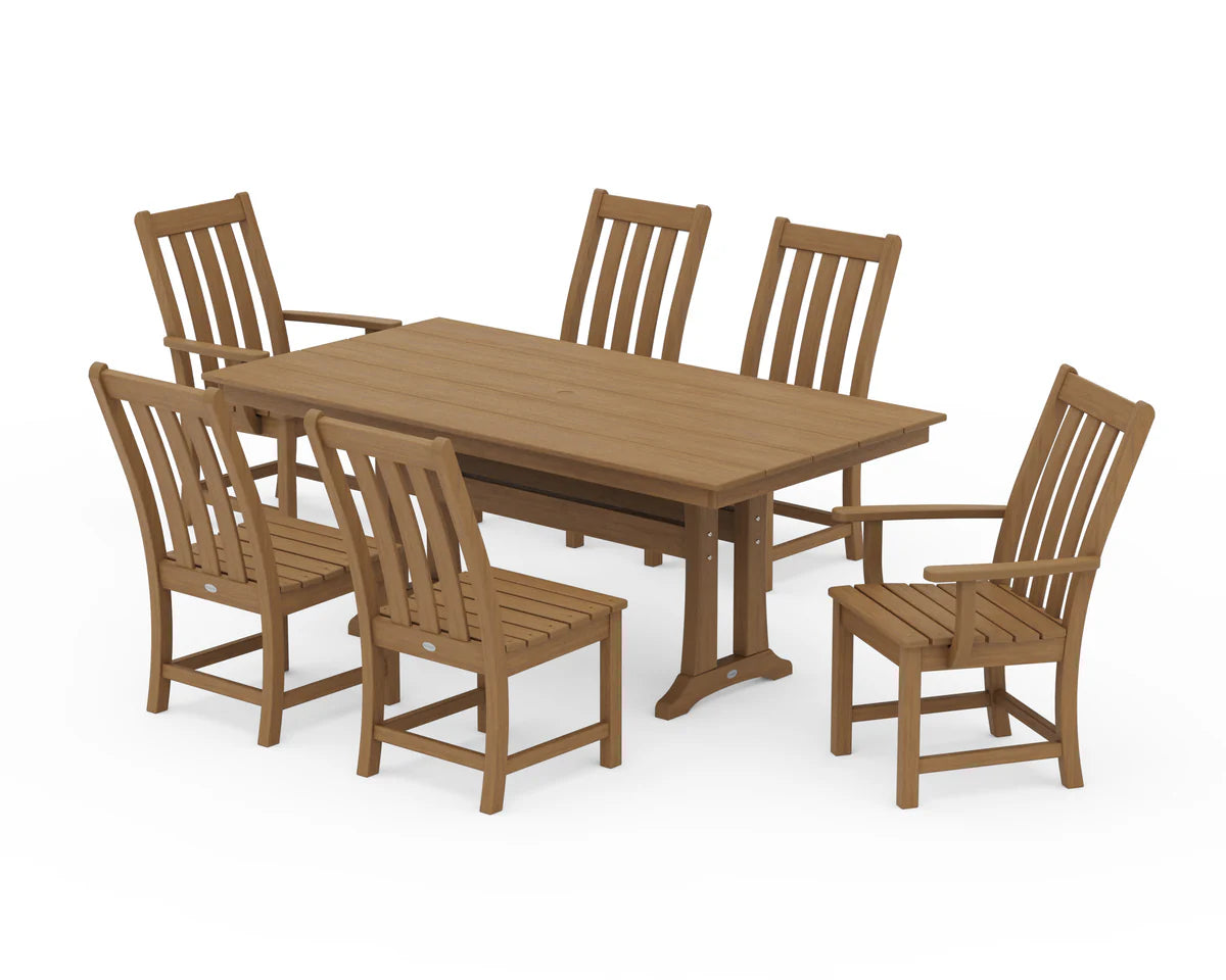 Wooden dining table with six matching chairs on a white background