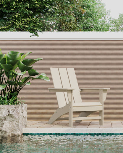 Lifestyle photo of the POLYWOOD Modern Adirondack Chair in Sand