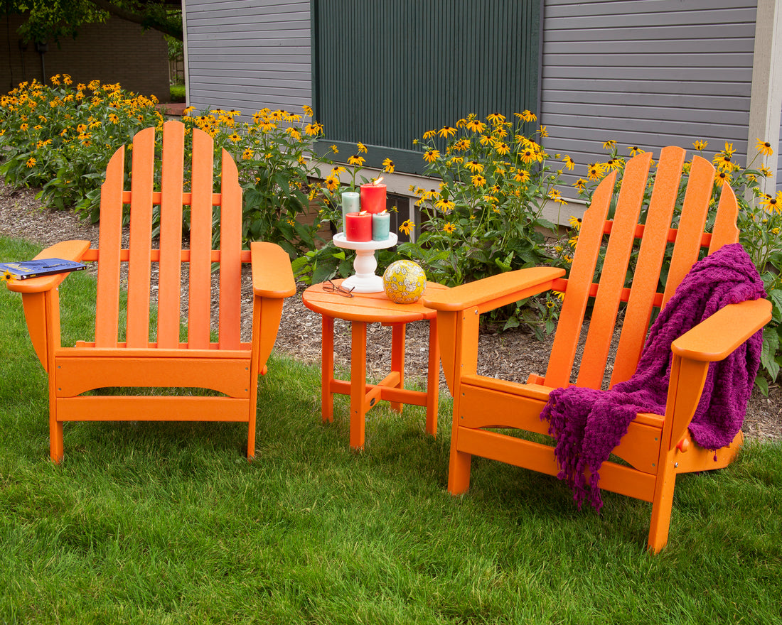 POLYWOOD Round 18" Side Table in Tangerine in an outdoor setting