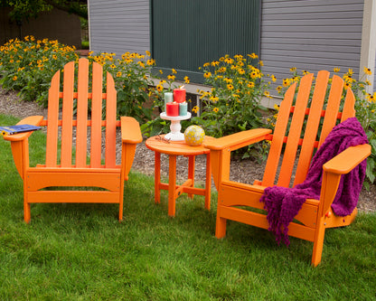 POLYWOOD Round 18" Side Table in Tangerine in an outdoor setting