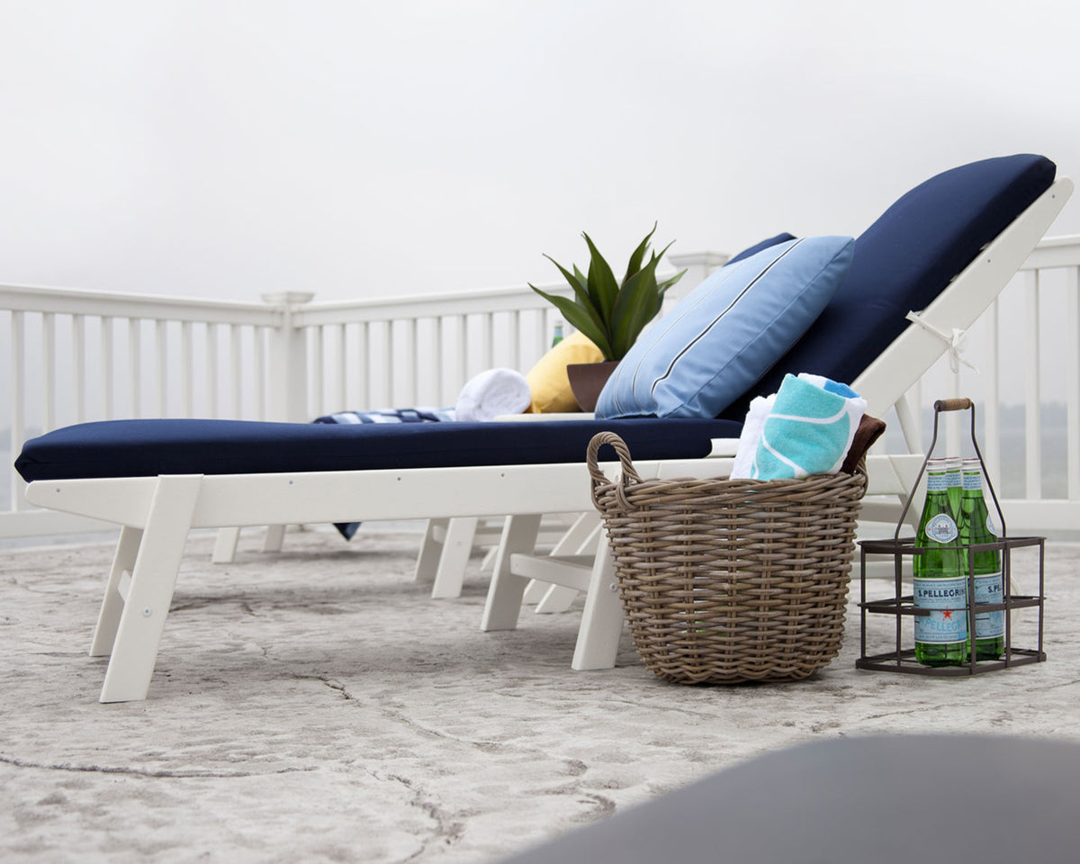 Lifestyle photo of the POLYWOOD Nautical Chaise with Wheels in White