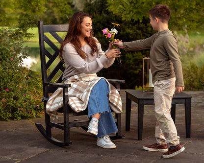 Lifestyle photo of the POLYWOOD Chippendale Porch Rocking Chair in Black