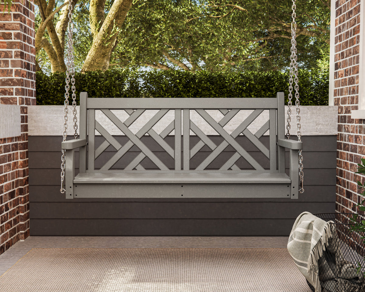 Slate Grey POLYWOOD Chippendale 48" Swing hanging on a brick porch