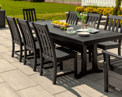Lifestyle photo of the POLYWOOD Vineyard 9-Piece Farmhouse Dining Set with Trestle Legs in Black (2)