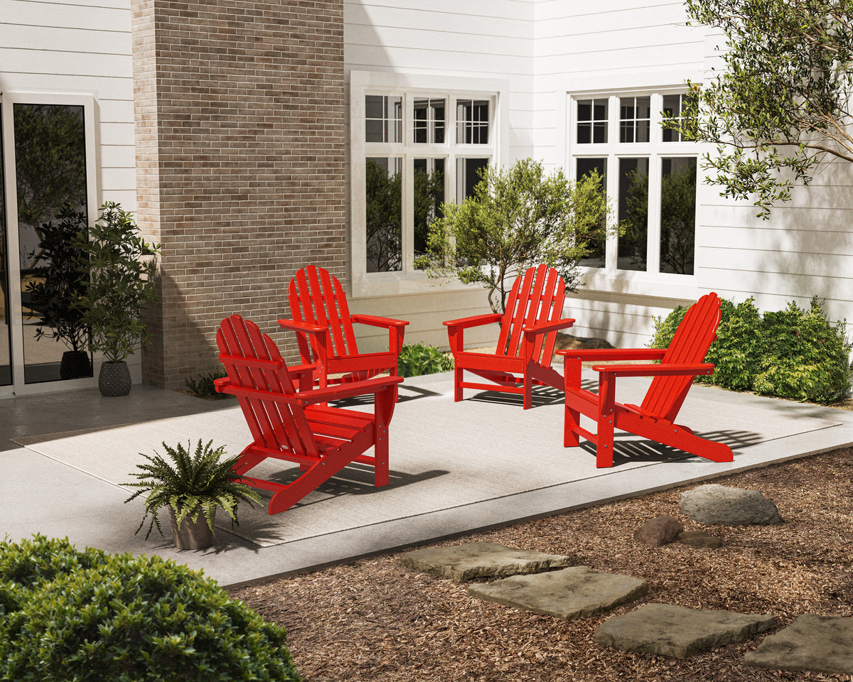 POLYWOOD 4-Piece Classic Adirondack Conversation Set in Sunset Red in an outdoor setting