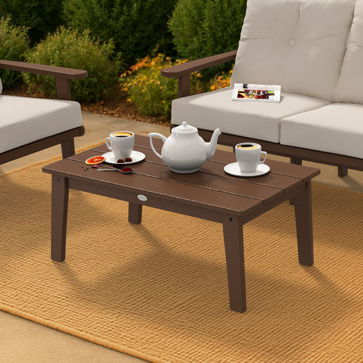 Second lifestyle photo of the POLYWOOD Lakeside Coffee Table in Teak