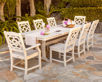 Lifestyle photo of the POLYWOOD Chinoiserie 9-Piece Dining Set with Trestle Legs