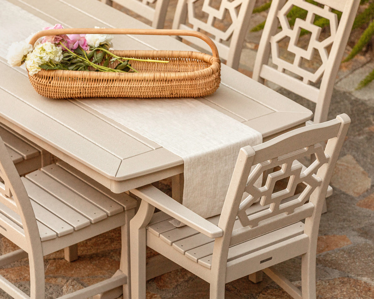 Lifestyle photo of the POLYWOOD Chinoiserie 9-Piece Dining Set with Trestle Legs