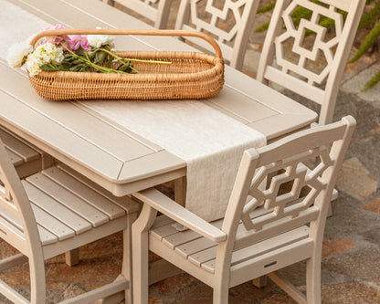 Lifestyle photo of the POLYWOOD Chinoiserie 9-Piece Dining Set with Trestle Legs
